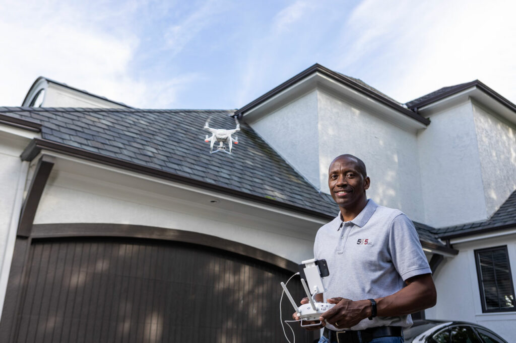 Small business owner Reggie Hines controls a drone